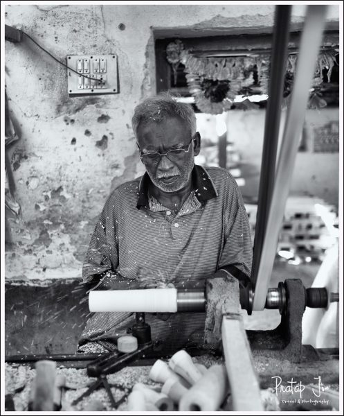 Artist making wooden toys