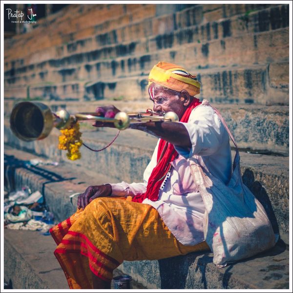 Dassayas blow a long trumpet quite frequently