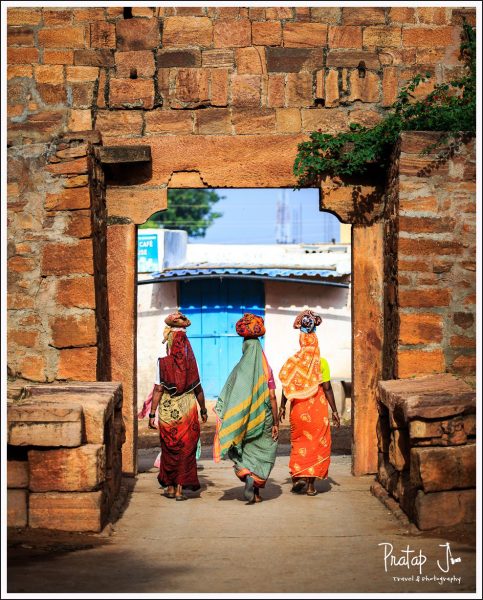 Women of Badami walking with pots on their heads