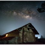 Milky Way in the sky with a house in the foreground